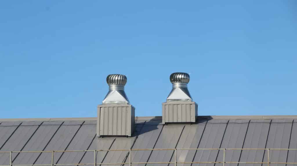 shiny metal air ventilation on roof rotates to clean air
